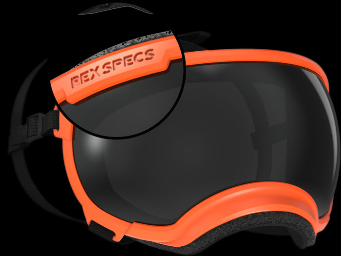 Close-up of orange Rex Specs goggles with a black lens and adjustable strap.